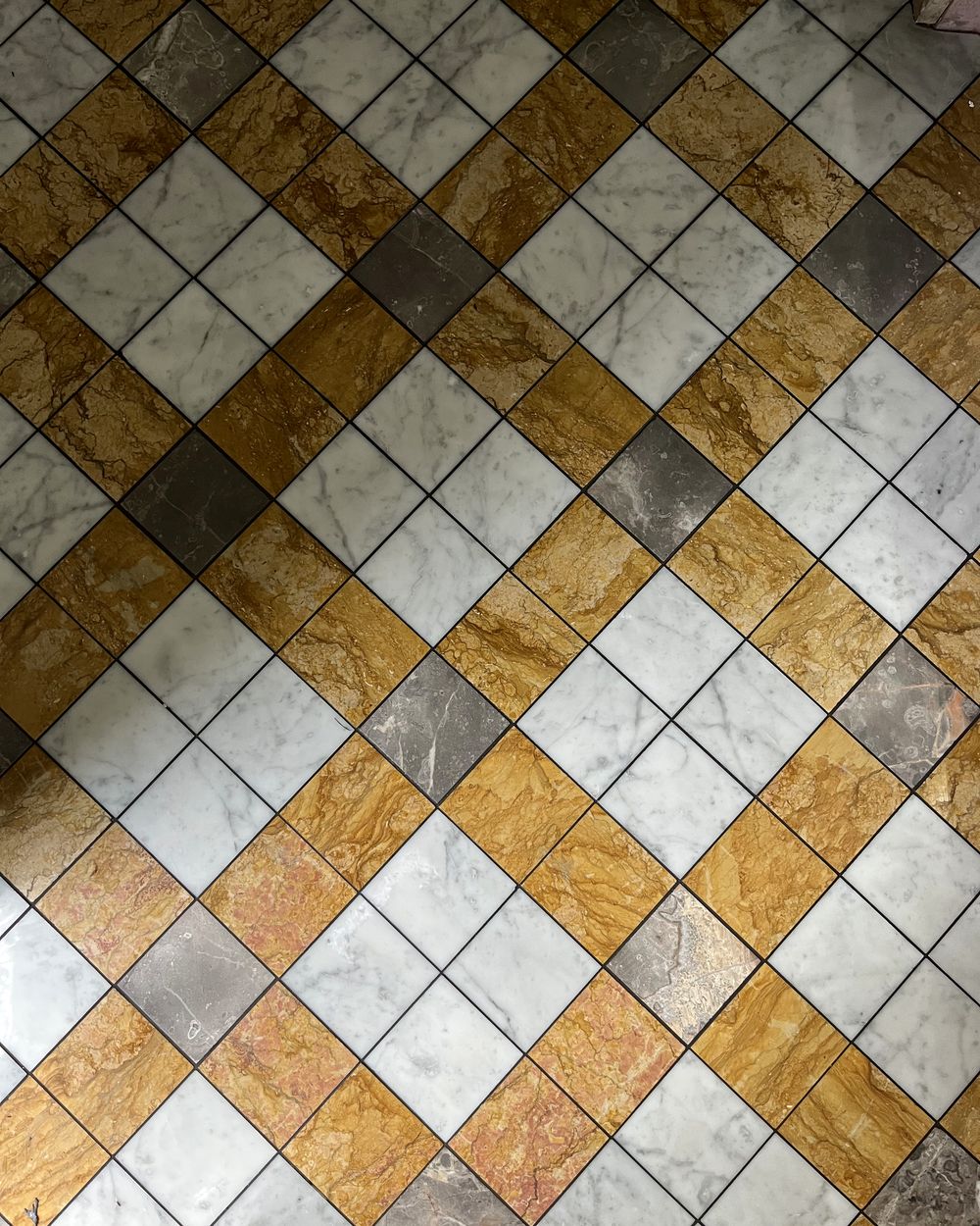 Diamond-pattern marble mosaic flooring installed by Homsigroup Ltd